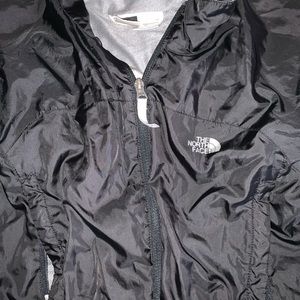 Black North Face rain coat in woman’s S